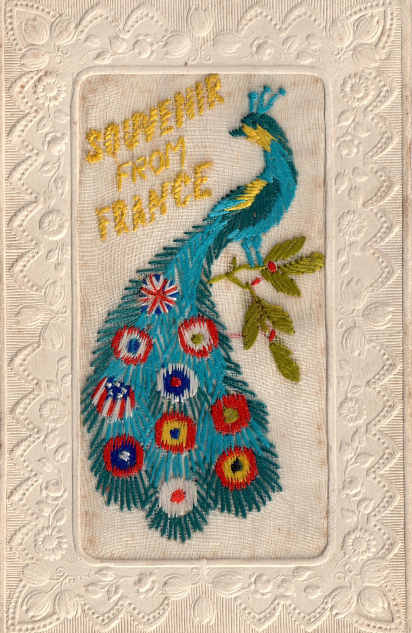 Embroidered postcard from the First World War, with the flags of the Allies depicted on the feathers of a peacock (TRC 2015.0434).