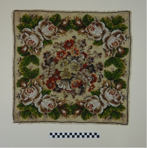 Berlin work panel using applied glass bead and hand embroidery with woollen threads (1860’s; TRC 2008.0433).