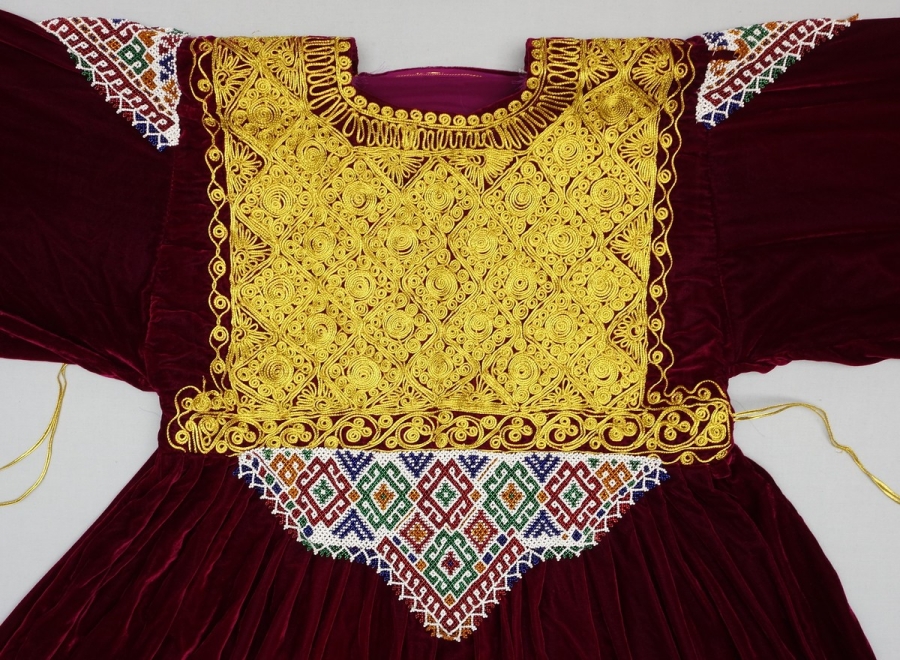 Detail of a velvet Pashtun wedding dress with a chest panel decorated with beading and passementerie (Afghanistan).