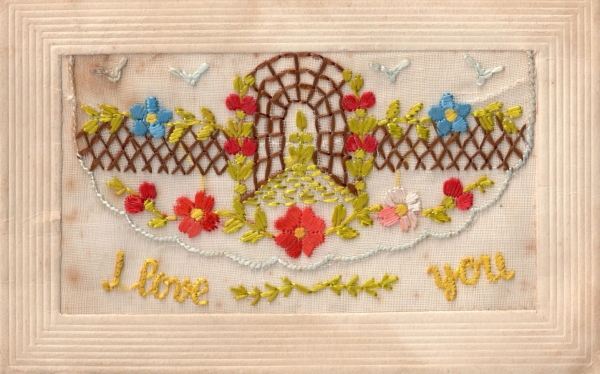 Early 20th century silk embroidered postcard with the text &quot;I love you&quot;.