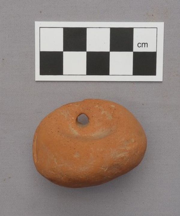 Archaic Greek loom weight, made of clay.