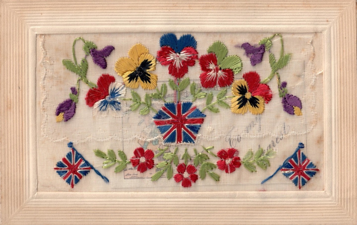 Silk embroidered postcard from the First World War, with pansies and British flags.
