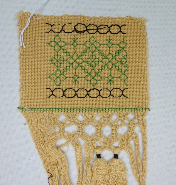 Hand embroidered sample, from a memory box of a Dutch woman in a Japanese internment camp.