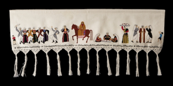 Palestinian panel with embroidered depiction of a wedding.