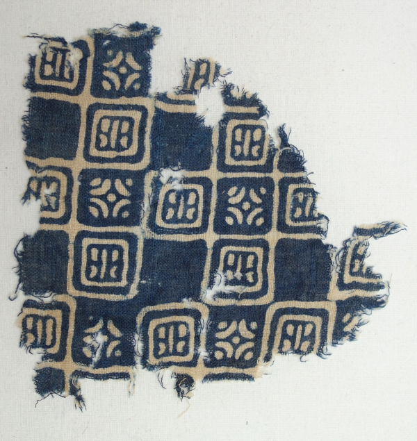 Fragment of a medieval, Indian block printed textile using a resist technique, excavated at Quseir al-Qadim, Egypt, in 1980.