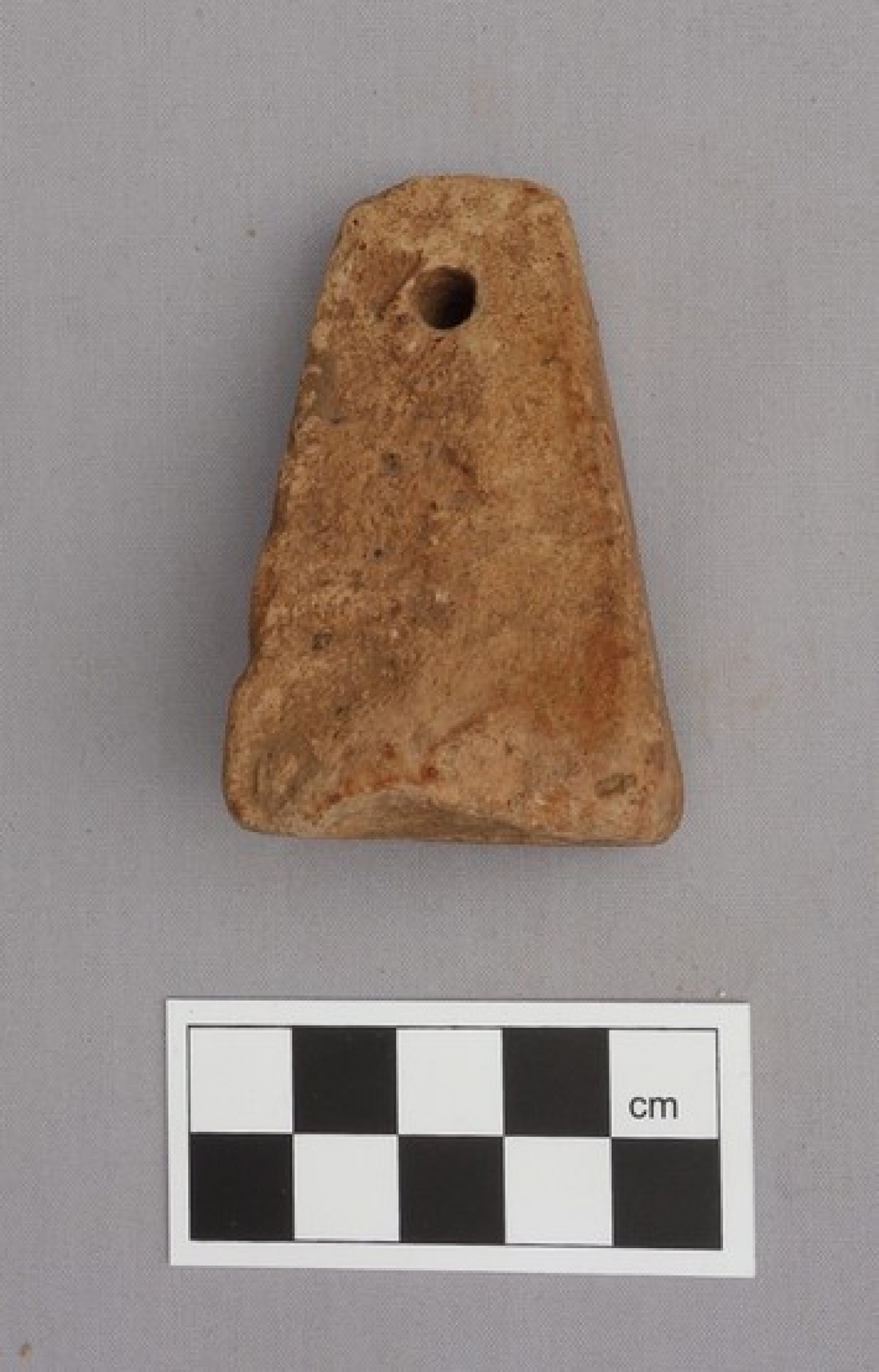 Archaic Greek loom weight, made of clay.