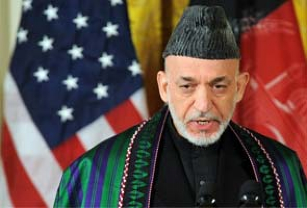 Hamid Karzai, President of Afghanistan 2001 (2004)-2014, wearing a chapan coat and karakuli headdress.