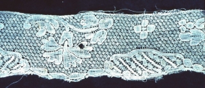 Piece of mid-18th century Mechlin lace, with its patterns outlined with cordonnet.
