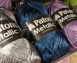 Balls of metallic yarns.