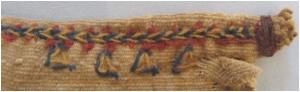 Close-up of the embroidered woollen cloth from Deir Abu Metta (object number 32/405 A7-1 (10) 1c S08.009; 5th century; photograph by courtesy of Rosanne Livingstone).