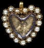 Gold pendant with a border of half pearls surrounding an embroidery under faceted crystal, c. 1700, England.