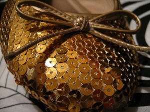 Gold spangles on a shoe.