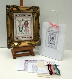 Example of a wedding and anniversary cross-stitch sampler kit.