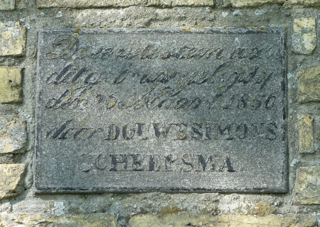 Commemorative stone inserted into the wall next to the front door of the new farmhouse of the Scheepsma family, dated 26 March 1856, with the name of Akke's youngest brother, Douwe Simons Scheepsma.