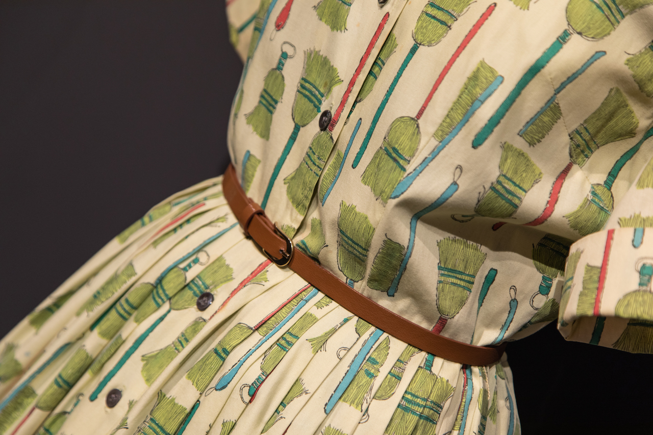 Dress with an Andy Warhol design of broomsticks. Courtesy Fashion + Textile Museum, London.