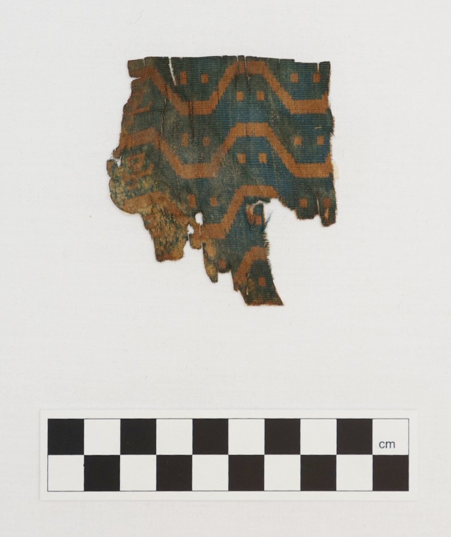 Silk cloth fragment from Xinjiang, probably Niya, dug up by Aurel Stein. The sample may date to the 2nd century AD (TRC 2000.0009).