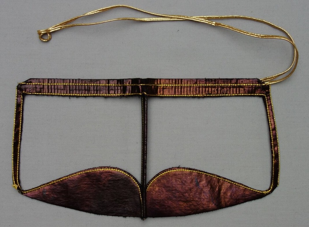 Battulah face mask for an (Arab) urban woman from southern Iran, late 20th century (TRC 2001.0022).