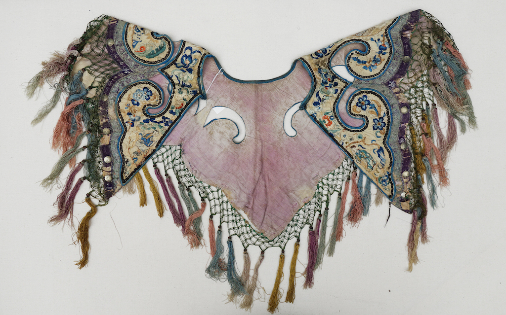 Large silk 'cloud' collar for a woman, with embroidered panels and open areas, China, early 20th century (TRC 2004.0108).