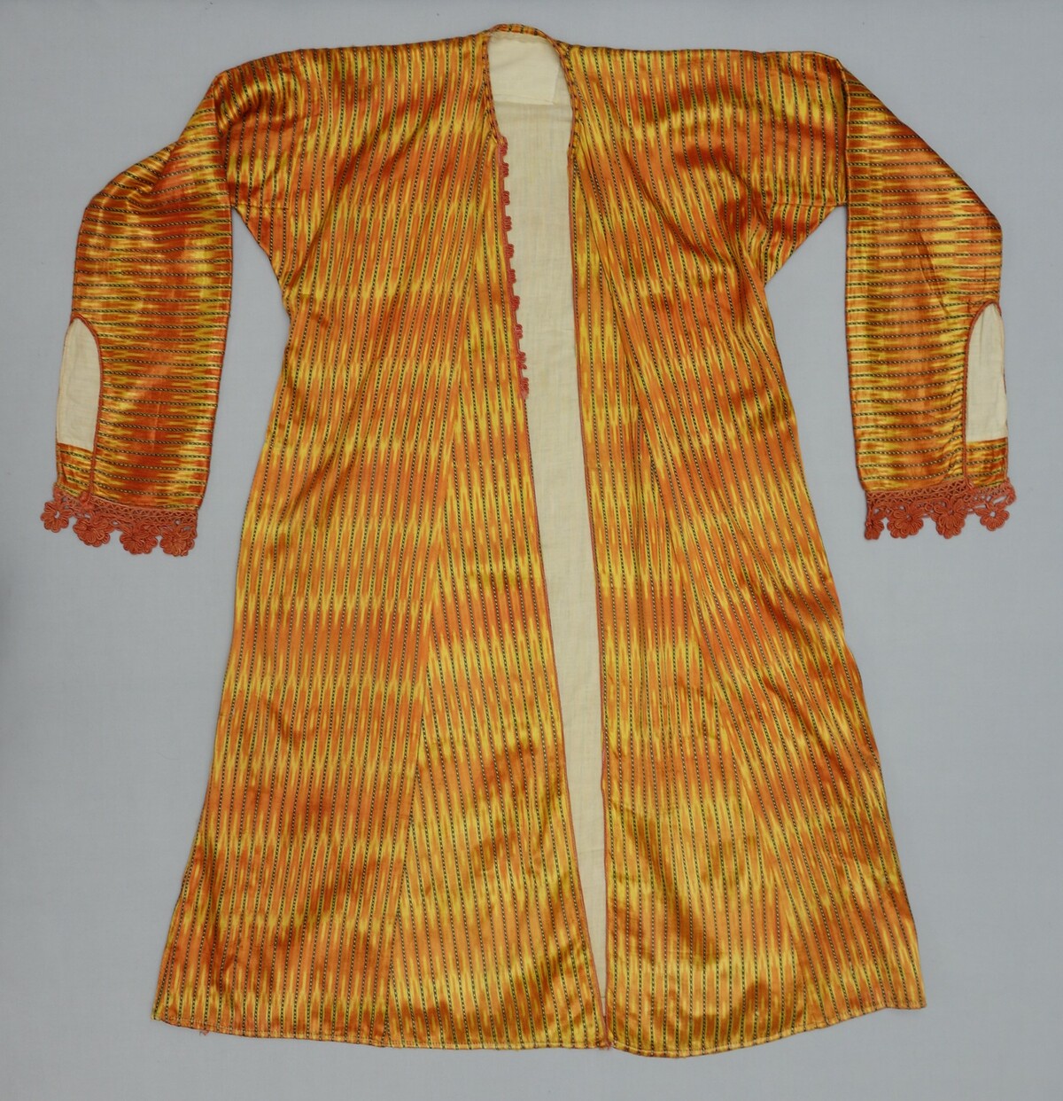 Long woman's coat of ikat dyed silk, Ma' an, 1920's (TRC 2005.0076).