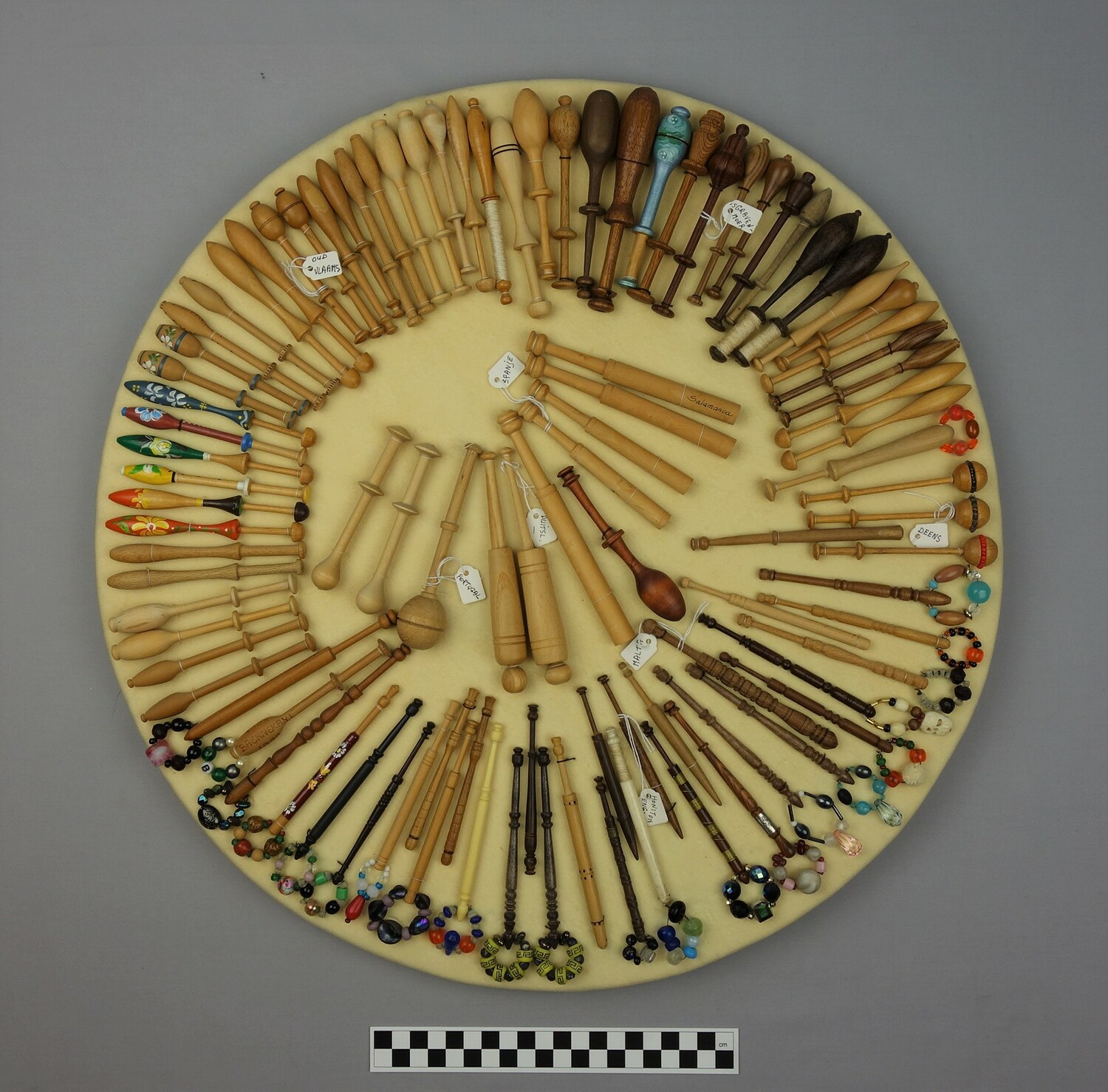 Board with lace bobbins (TRC 2007.0494).