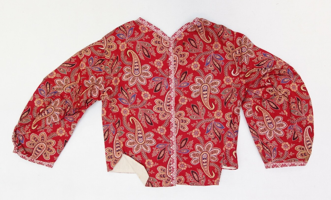 Fig. 1. A jacket made from a red cotton cloth decorated with a multi-coloured floral and paisley pattern. From the island of Marken, The Netherlands, 1937 (TRC 2007.0525c).