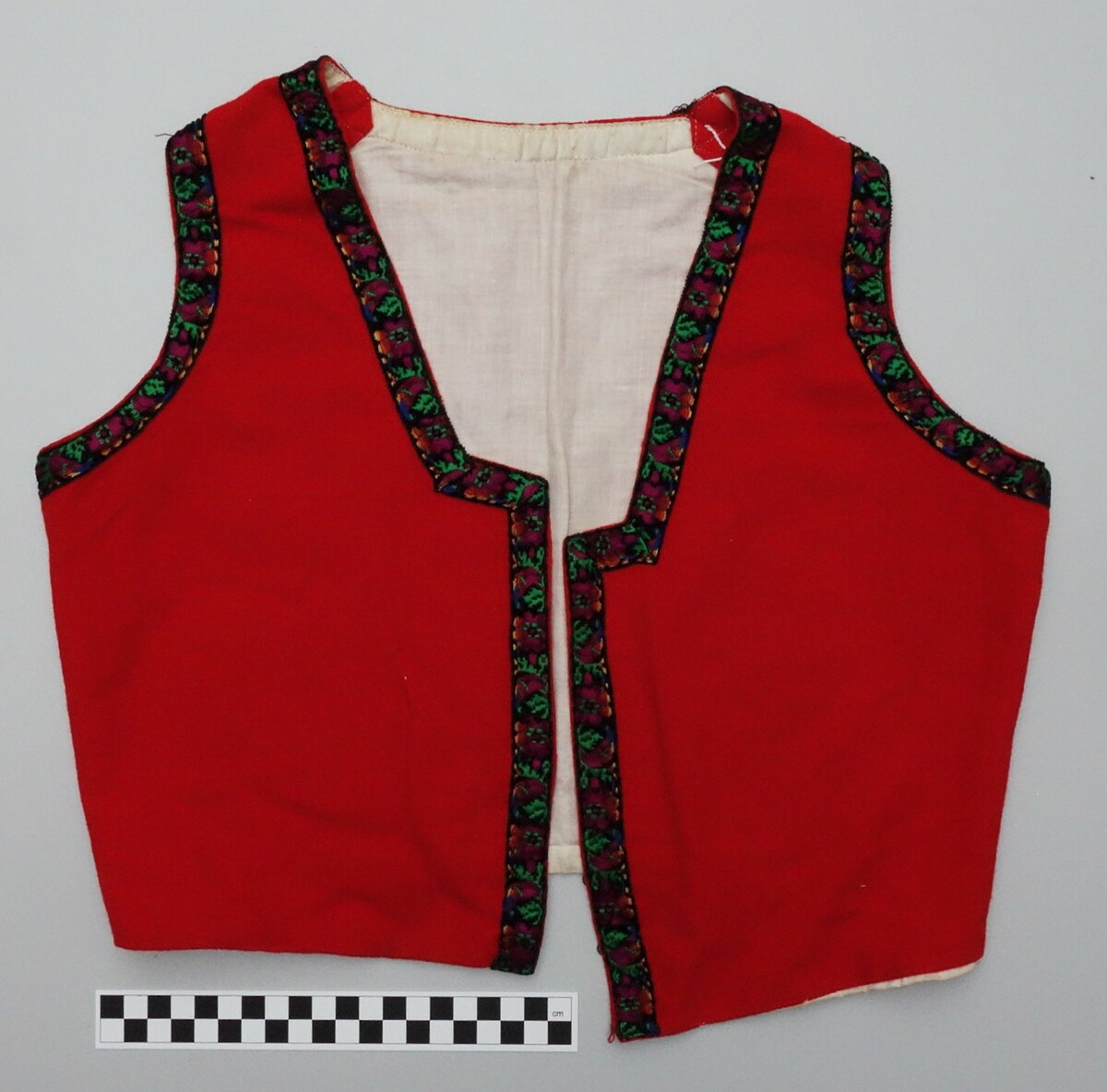 Woman's red felt waistcoat from Norway (TRC 2007.0841b).