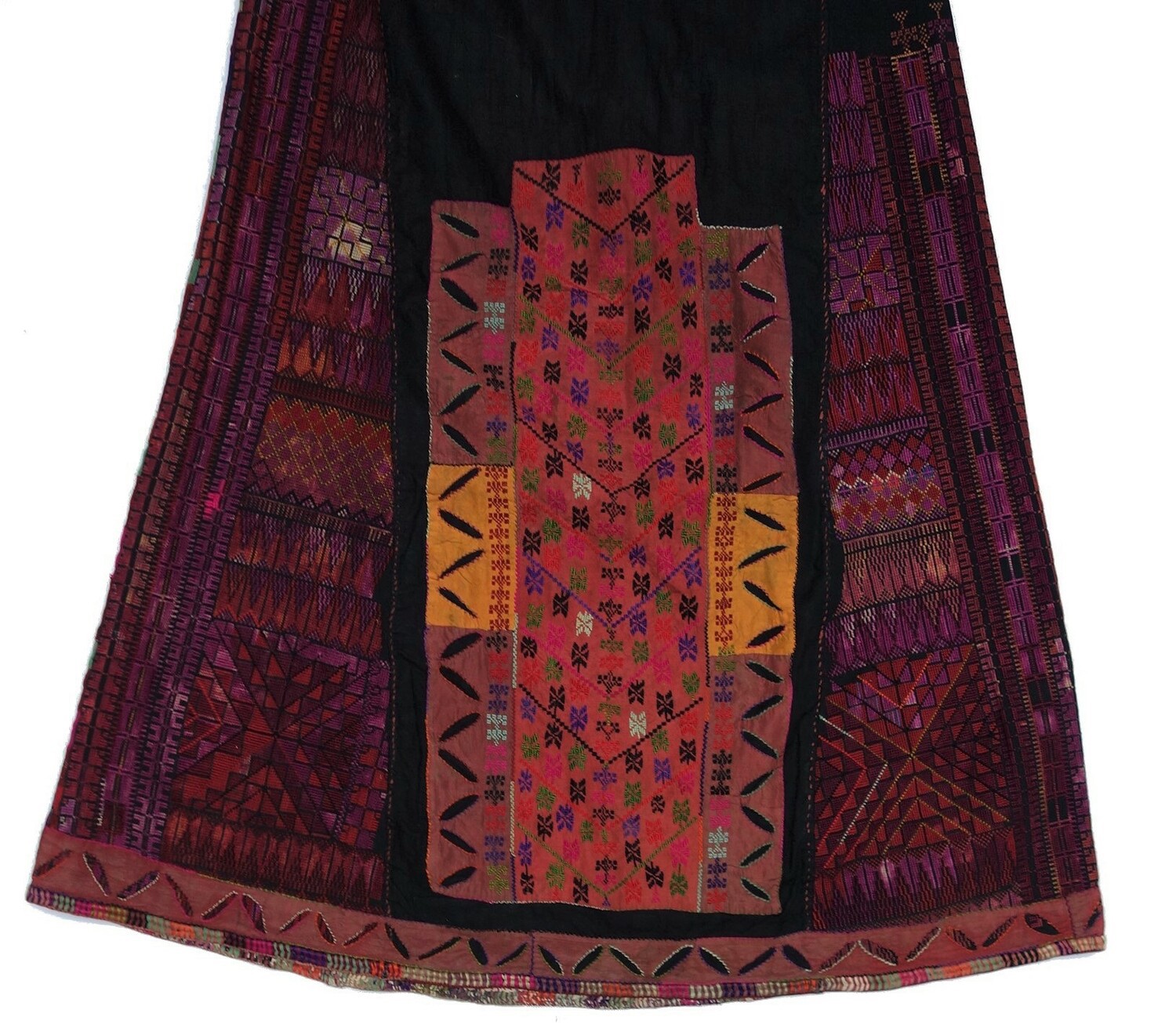 Detail of an embroidered woman's dress from Hebron, c. 1920 (TRC 2009.0194). Embroidery includes blocks with geometric motifs, but also cyprus trees and other motifs, all worked in cross stitch.