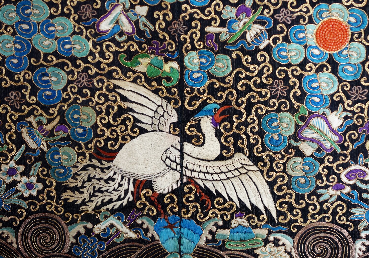 Fig. 3. Detail of a woman's decorative badge, applied to the front of the surcoat, that signified a 5th rank civil official's wife in Qing China. Late 19th century (TRC 2010.0139b).