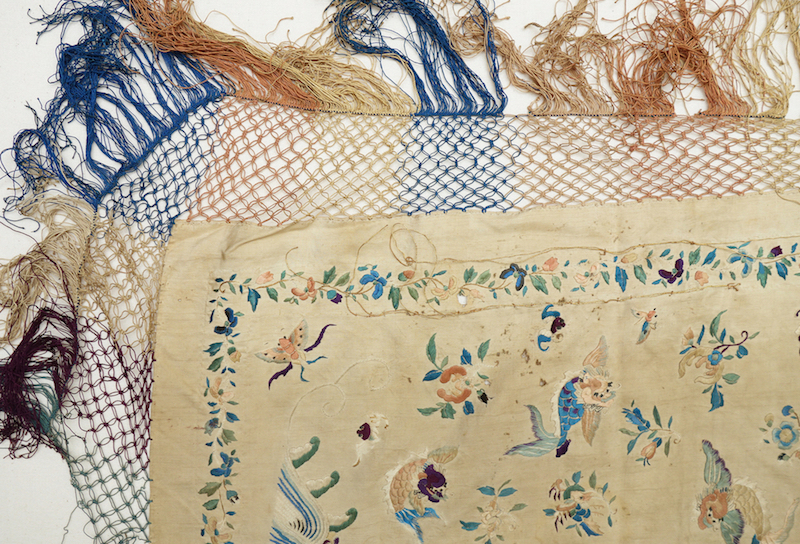 Fig. 4. Detail of a woman's shawl with a central dragon chasing a flaming pearl. China, early 20th century (TRC 2012.0282).
