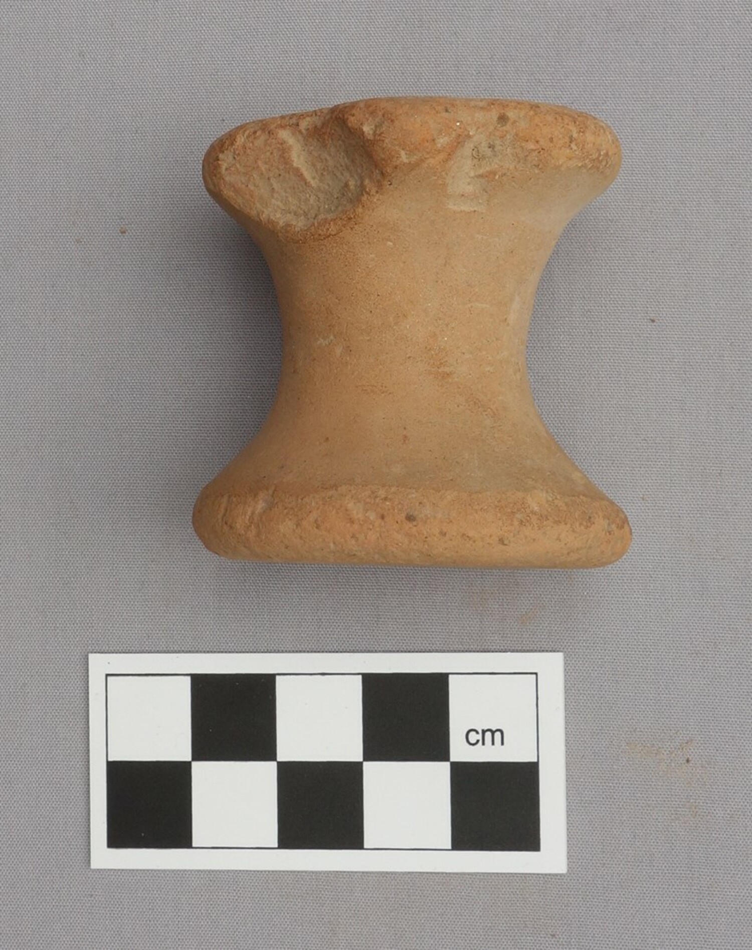 Ancient Greek baked-clay spool (TRC 2014.0797).