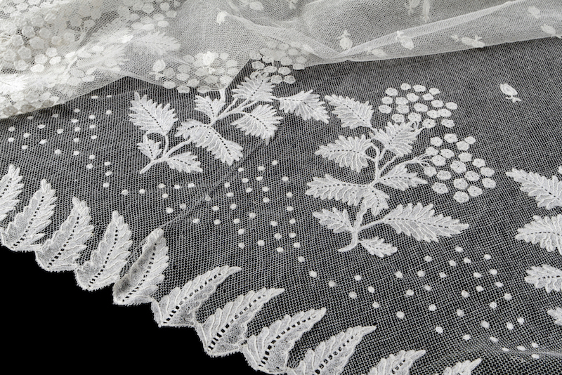 Fragment of a lace shawl (embroidered net lace) given by Princess Anne Paulowna (1795-1865), daughter of Tsar Paul I of Russia (and the wife of the later King Willem II) to Maria Petronella s’Jacob-Rochussen (1792-1848) for the christening of her daughter in 1822 (TRC 2014.0831).