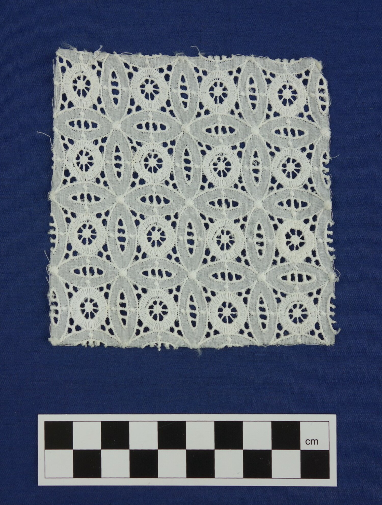 Example of broderie anglaise with a geometric pattern, machine-made, late 20th century (TRC 2014.0919).