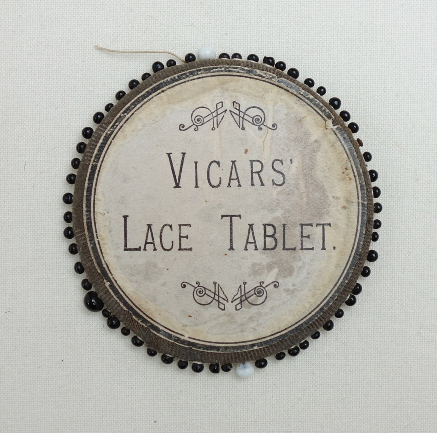 Vicar's lace tablet from the UK, late 19th century (TRC 2015.0632).