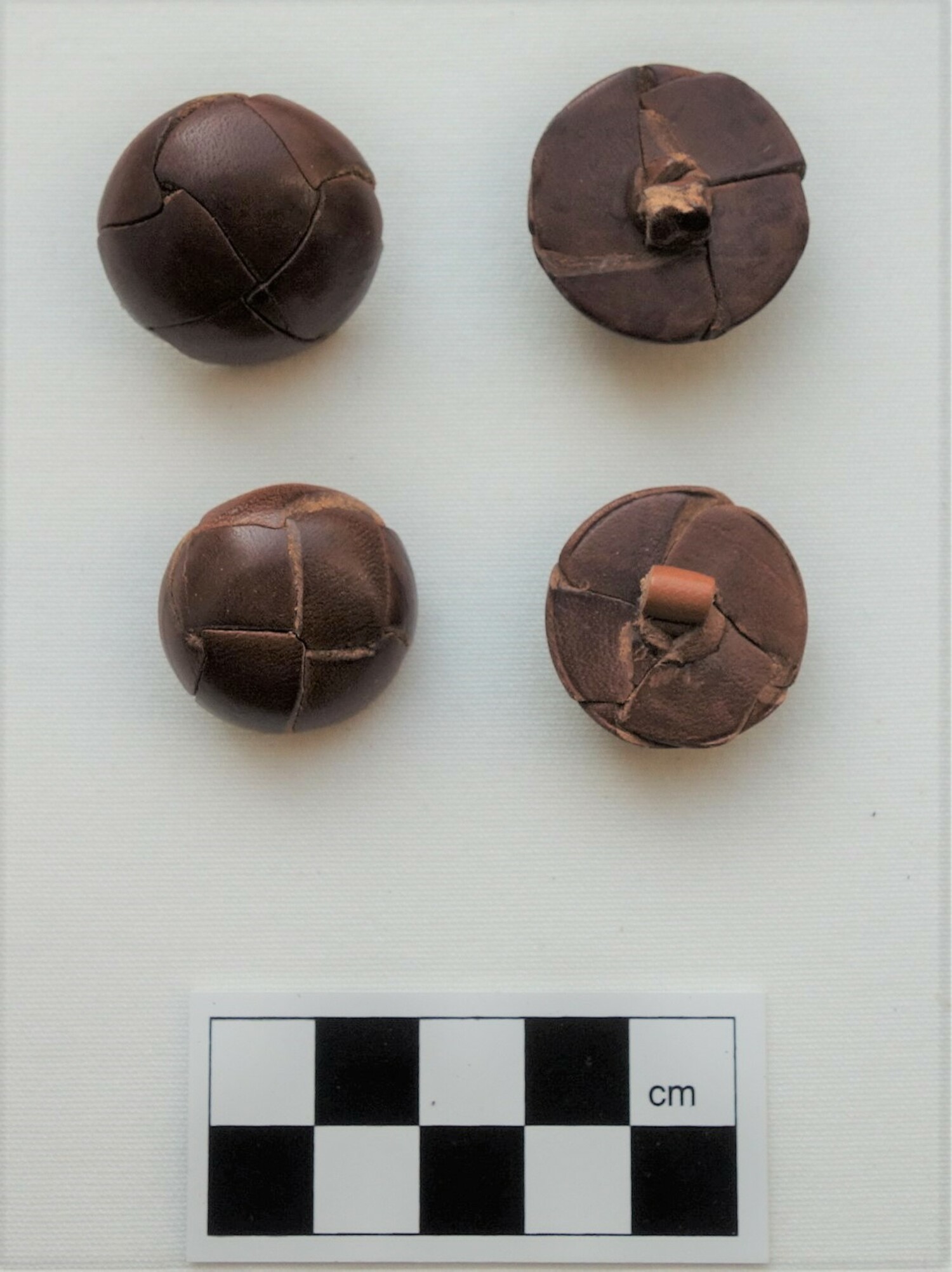 Set of leather buttons. Europe, 1930s (TRC 2018.2197a d).