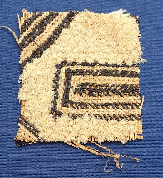 Fragment of decorated raffia weave, Kuba, Congo, mid-20th century (TRC 2019.1699).