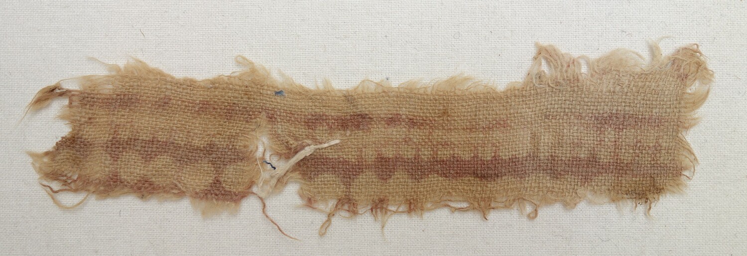 Fragment of a block printed textile using a resist technique, 14th century, originally from India, excavated in Egypt (TRC 2020.0234).