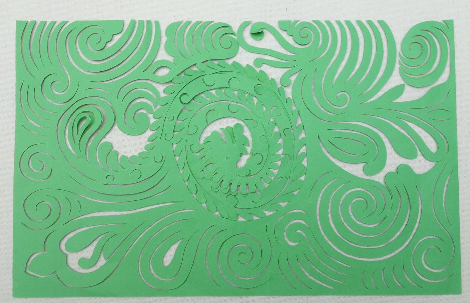 Fig. 6. Embroidery templates with a mother dragon motif, hand-cut paper. Miao, China, c. 2018 (TRC 2020.3206a–b).