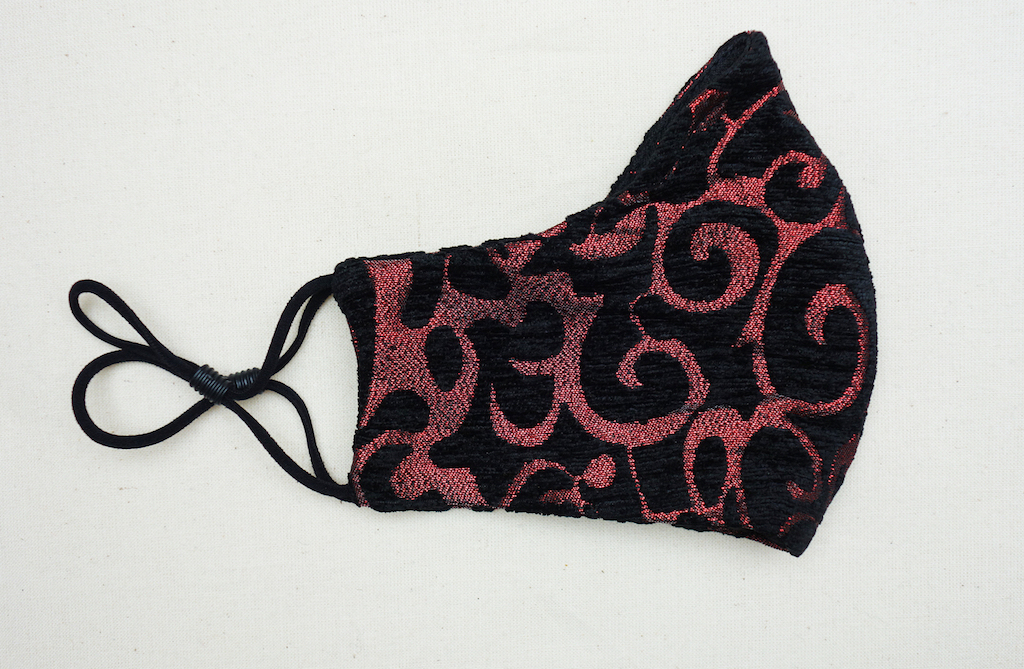 Face mask with a black-and-red scroll design for the Gothic Regency market, China/UK 2020 (TRC 2020.3996).