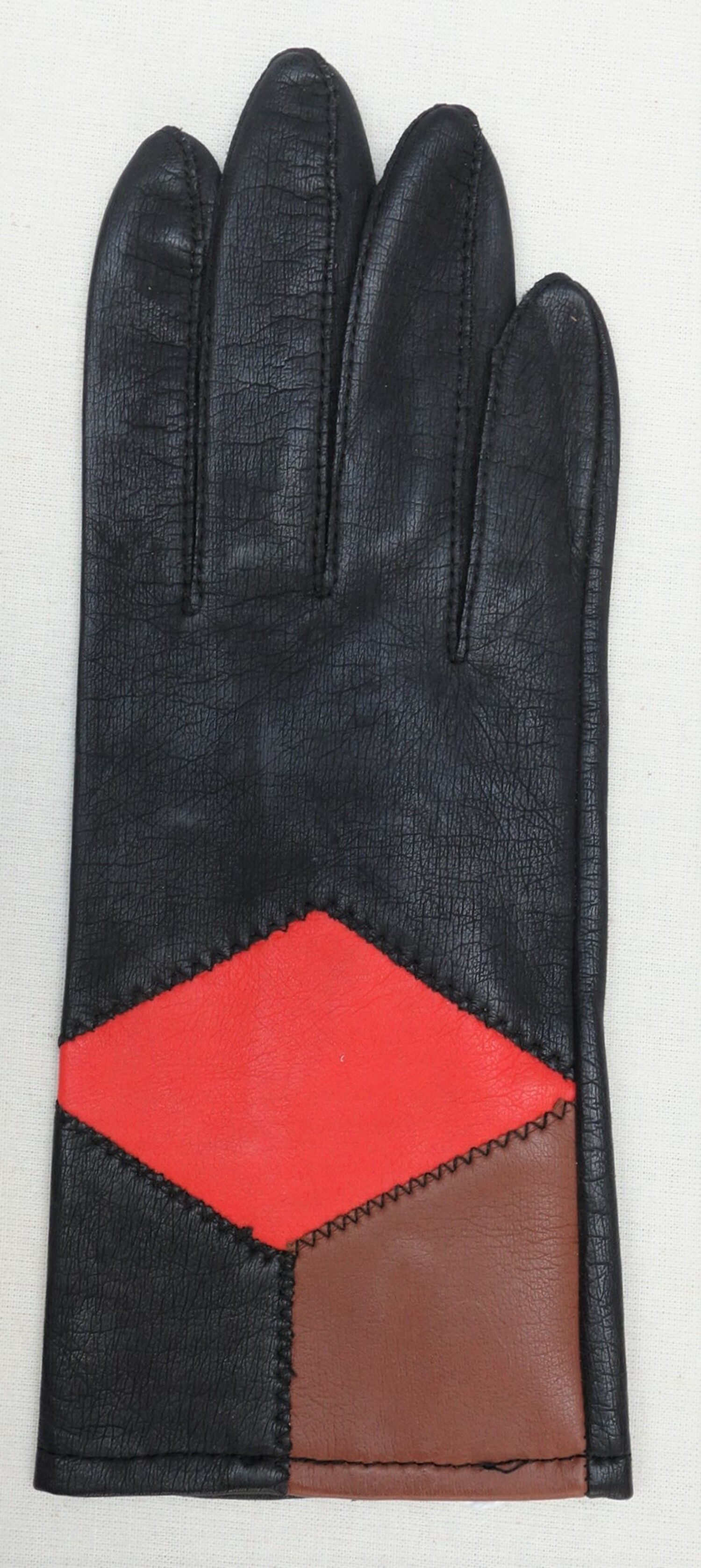 Glove with decorative inserts, produced in the early 1970s in communist Romania for the West European market (TRC 2022.0823l).