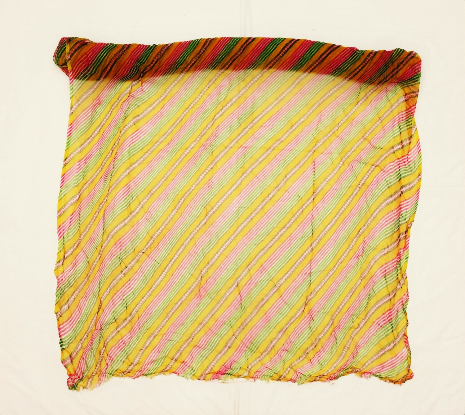 Long length of leheriya cloth with a colourful design of zig-zags in various widths and bright colours. Udaipur, Rajasthan, India (TRC 2022.2118).
