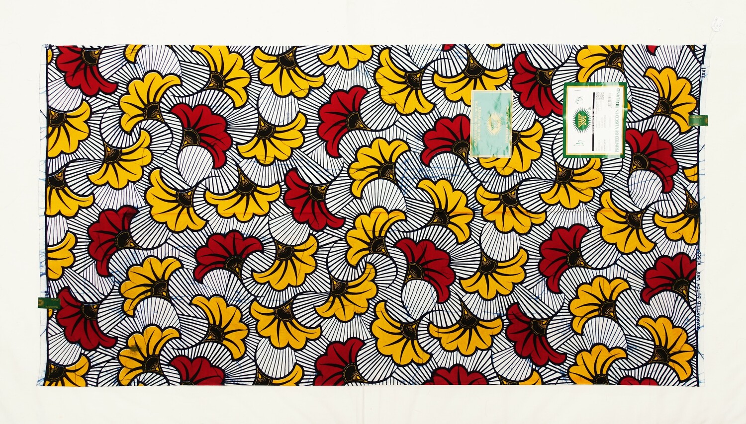 Japanese style ginkgo leaves on cloth produced for West Africa by Vlisco in the Netherlands. 2022 (TRC 2022.2261).
