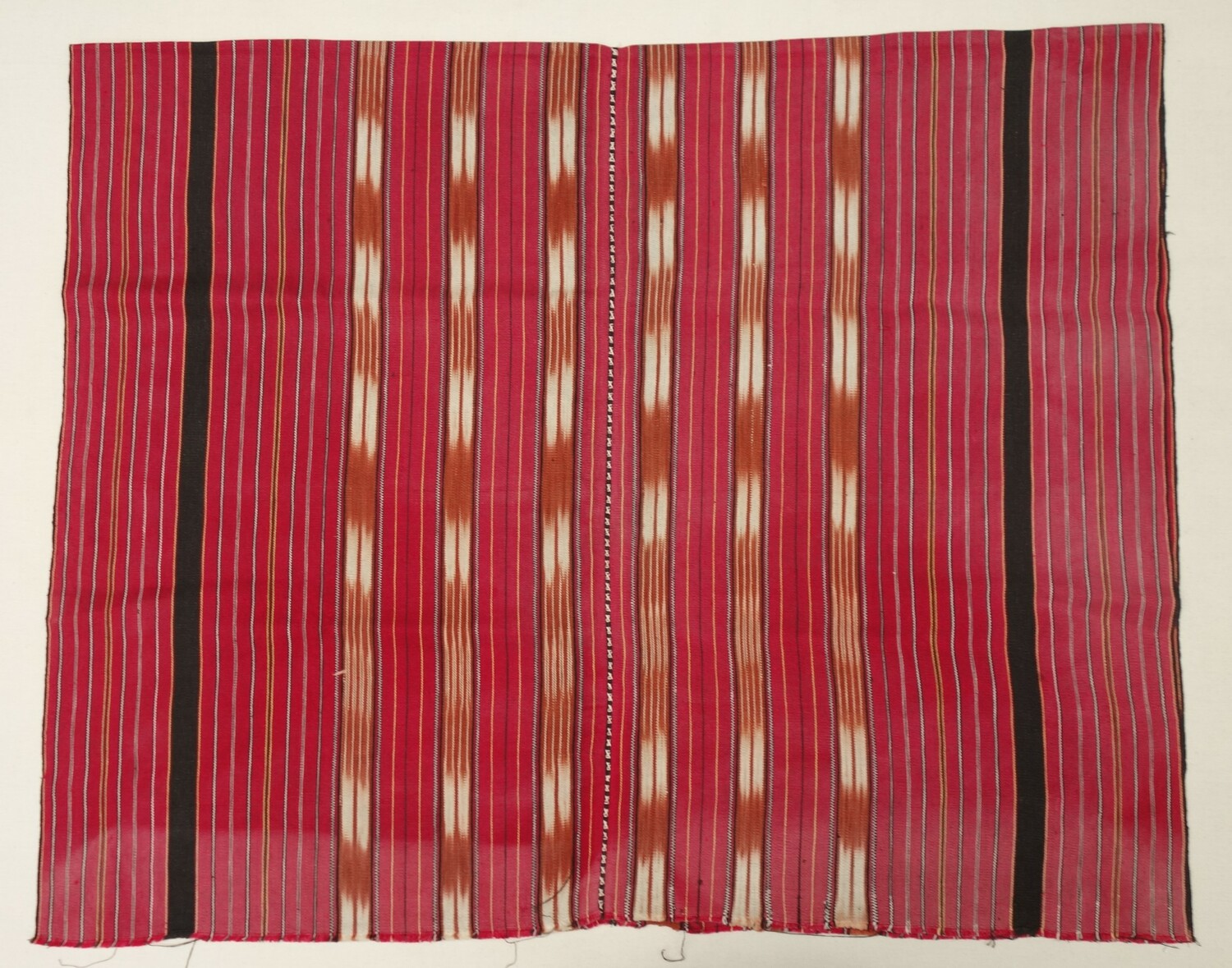 Skirt made from a hand woven, hand dyed (ikat), and hand embroidered cloth. Purchased in 1965 in Thailand from among the Karen (TRC 2023.0189).