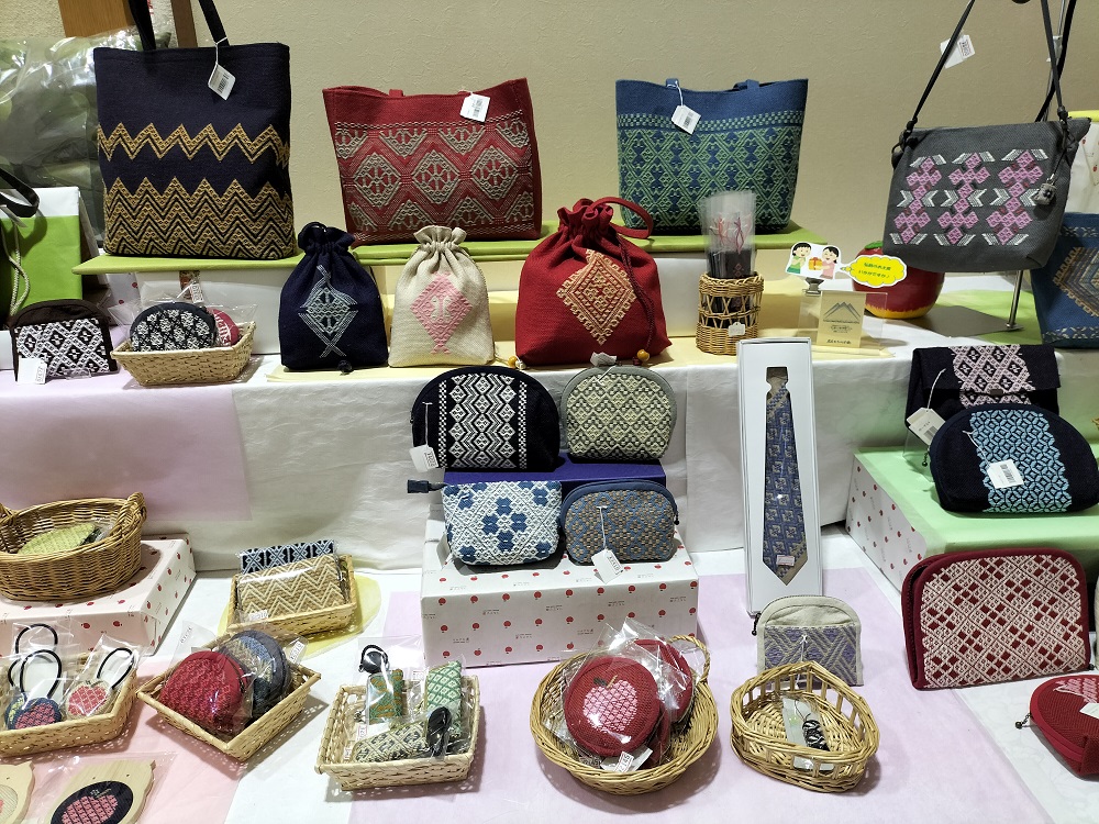 Various kogin products produced by local kogin group, at the souvenir shop of the Hirosaki Apple Farm. Photograph by author.