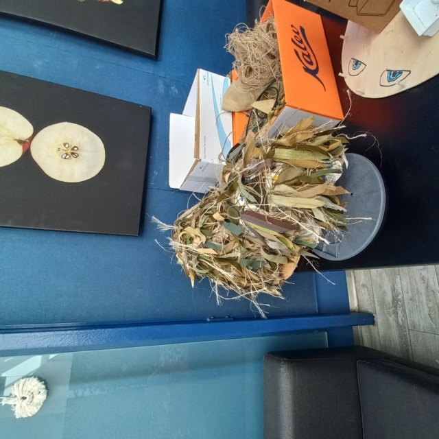 Helmets being covered with camo netting. University of Tartu, Estonia. 11 May 2023. Photograph by Gillian Vogelsang.