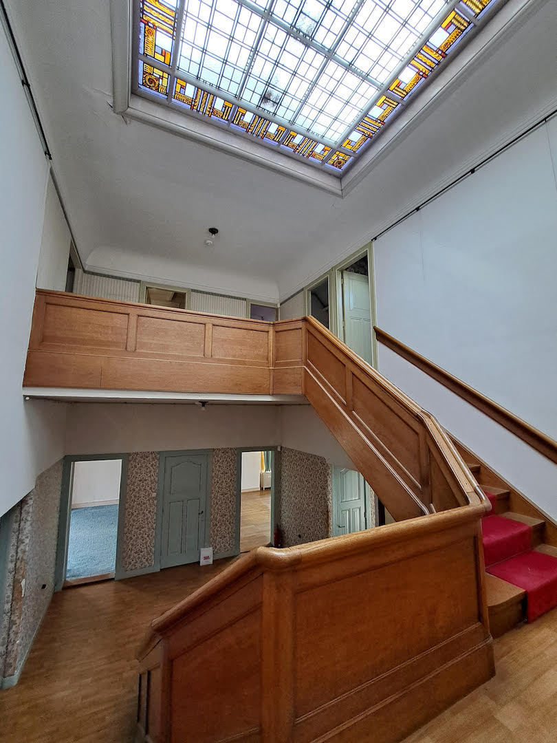 Inside Boerhaavelaan 6, the monumental staircase with stained glass ceiling.