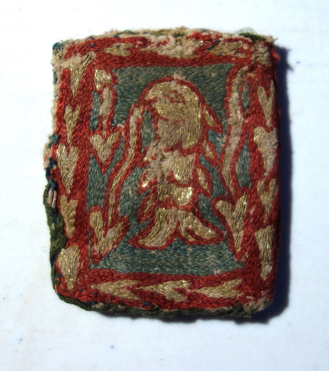 Small embroidered bag with the depiction of a fish, 13th century. Sens Museum (B321).
