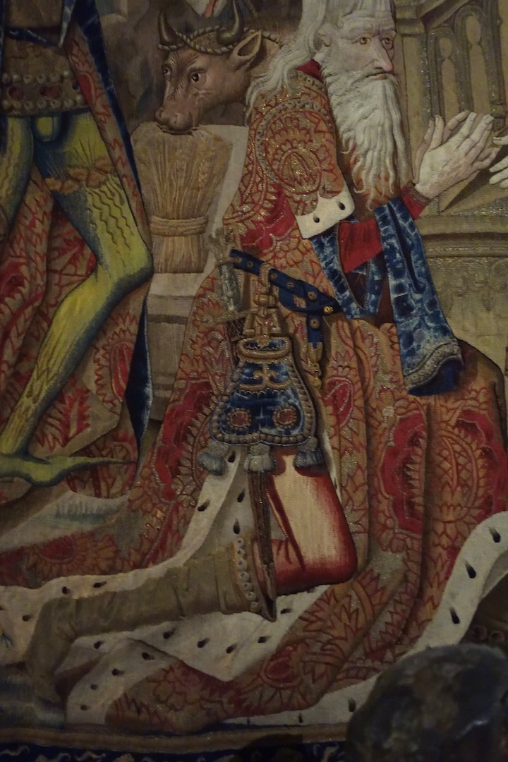 Detail of a medieval tapestry in Sens Museum, showing a man with a large bag attached to his belt.