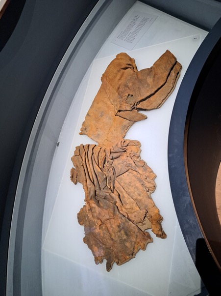 Fig 3: Woolen outfit, originally blue, with many signs of mending and patching. Photograph by author.