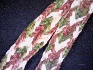 Dino-lite image of the silk band used as a bag strap.