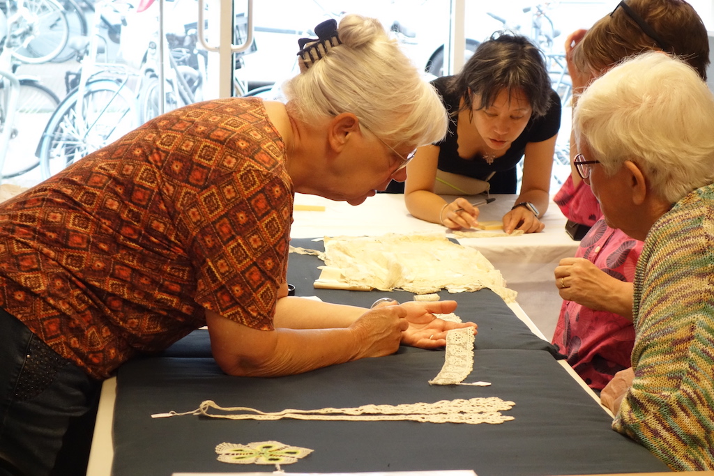 Studying samples of lace at the TRC, Saturday 26 August. Photograph by author.